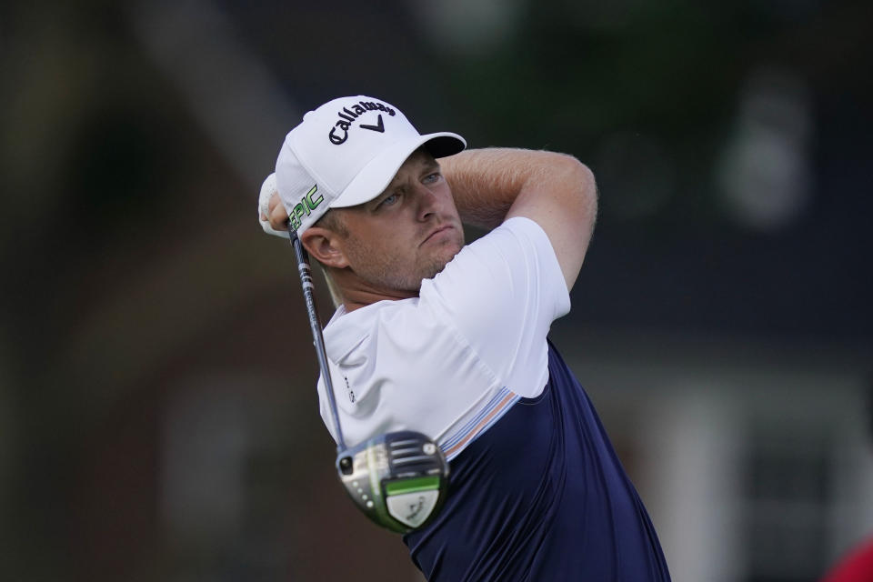 Tom Lewis watches his drive off the sixth tee during the second round of the Rocket Mortgage Classic golf tournament, Friday, July 2, 2021, at the Detroit Golf Club in Detroit. (AP Photo/Carlos Osorio)