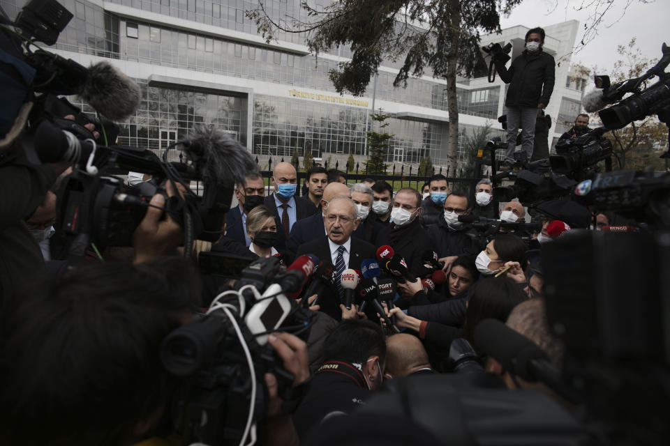 FILE - Kemal Kilicdaroglu, center, leader of Turkey's main opposition Republican People's Party, CHP, speaks to the media outside the Turkish Statistics Institute, or TUIK, in Ankara, Turkey, Friday, Dec. 3 2021. Kilicdaroglu, the main challenger to President Recep Tayyip Erdogan in the May 14 election, cuts a starkly different figure than the incumbent who has led the country for two decades. As the polarizing Erdogan has grown increasingly authoritarian, Kilicdaroglu has a reputation as a bridge builder and vows to restore democracy. (AP Photo/Burhan Ozblici, File)