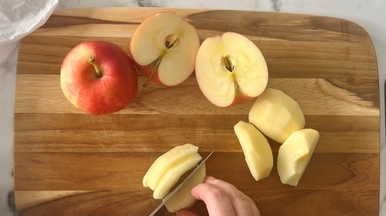 cut apples with fingers