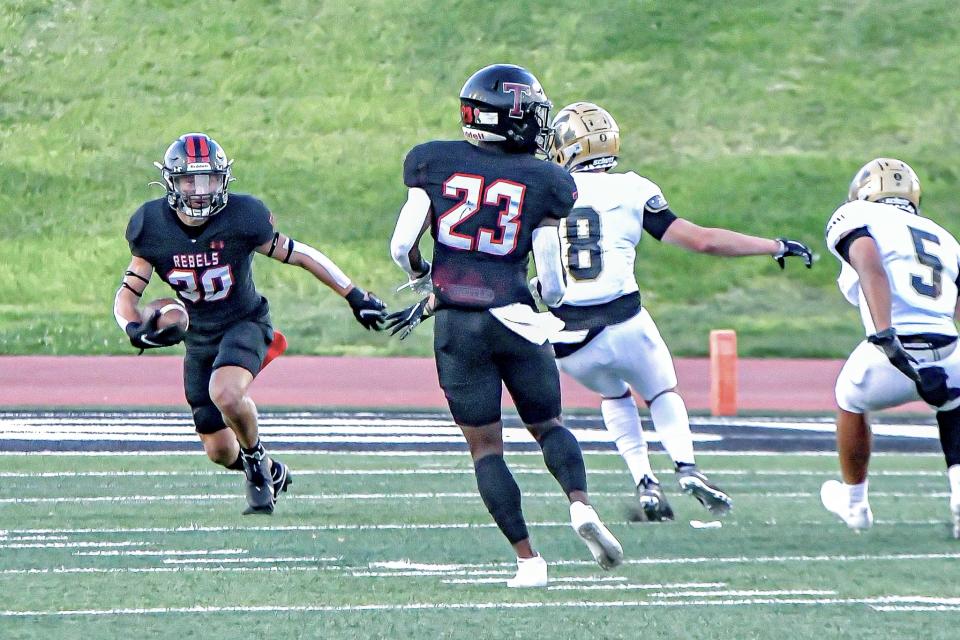 Tascosa's Hudson Farris runs up the field with the football during a nondistrict game Friday, Aug. 27, 2021, against Amarillo High at Dick Bivins Stadium in Amarillo.