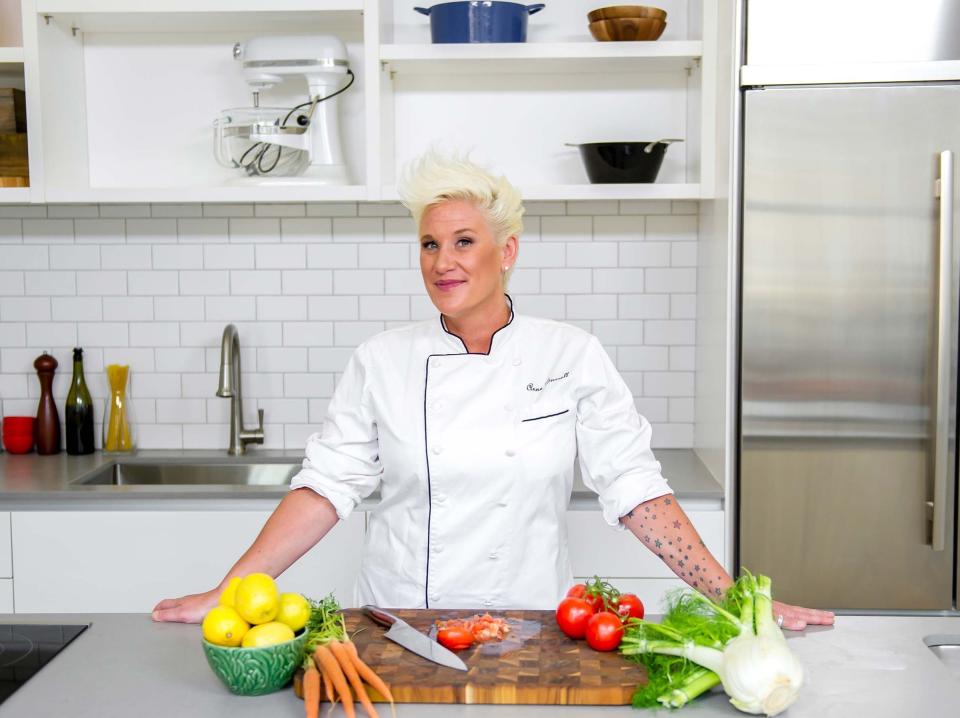 Anne Burrell in the kitchen with vegetables