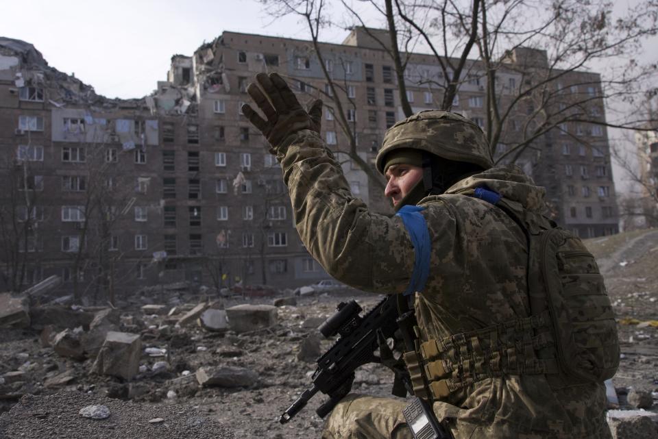 A Ukrainian serviceman guards his position in Mariupol, Ukraine, Saturday, March 12, 2022. Ukrainian military says Russian forces have captured the eastern outskirts of the besieged city of Mariupol. In a Facebook update Saturday, the military said the capture of Mariupol and Severodonetsk in the east were a priority for Russian forces. Mariupol has been under siege for over a week, with no electricity, gas or water. (AP Photo/Mstyslav Chernov)