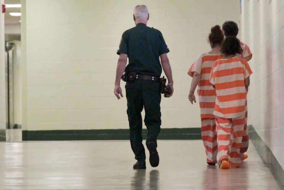 File photo of a detention deputy escorting female inmates at the county jail