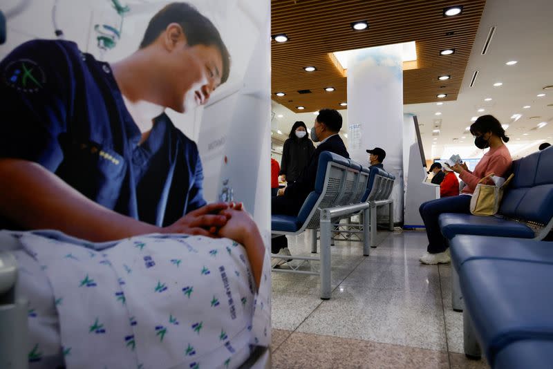 People sit as they wait at the Incheon Medical Center in Incheon