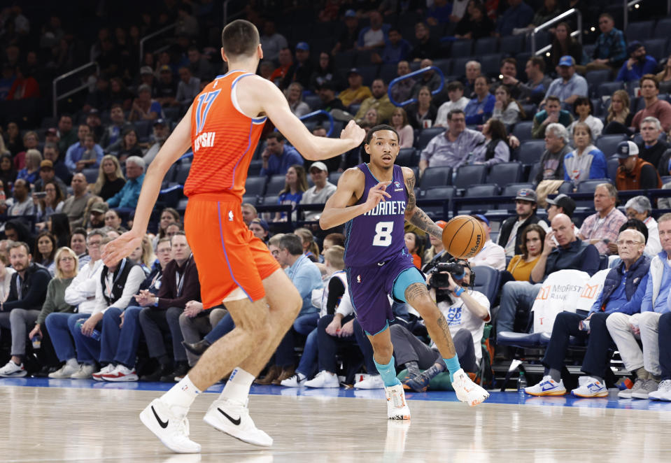 Feb 2, 2024; Oklahoma City, Oklahoma, USA; Charlotte Hornets guard Nick Smith Jr. (8) dribbles the ball down the court against the Oklahoma City Thunder during the second half at Paycom Center. Mandatory Credit: Alonzo Adams-USA TODAY Sports