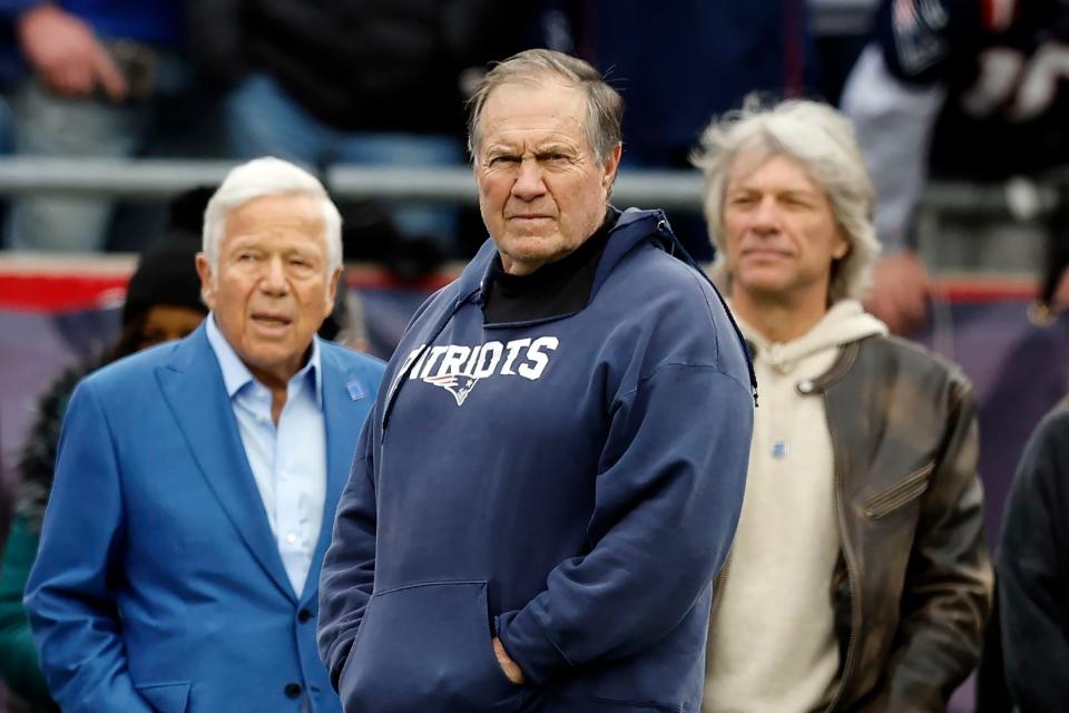 New England Patriots head coach Bill Belichick, center, stands in front of team owner Robert Kraft, left, and Jon Bon Jovi, right, prior to an NFL football game against the Kansas City Chiefs, Sunday, Dec. 17, 2023, in Foxborough, Mass. (AP Photo/Michael Dwyer)