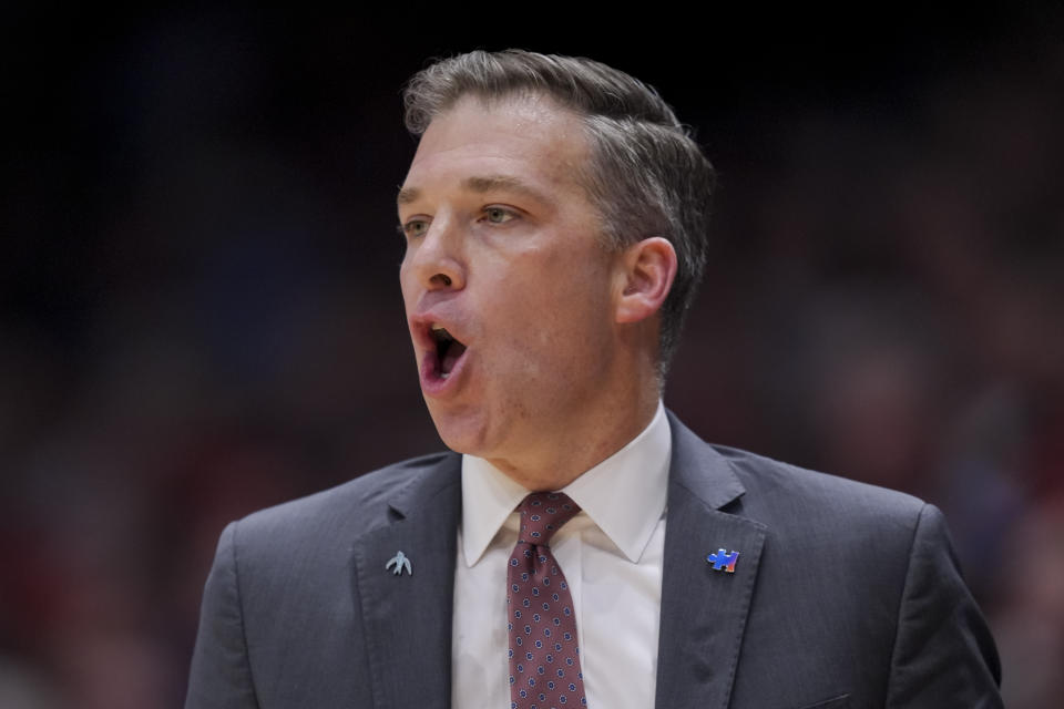 Davidson head coach Matt McKillop yells to his team from the bench during the first half of an NCAA college basketball game against Dayton, Tuesday, Feb. 27, 2024, in Dayton, Ohio. (AP Photo/Aaron Doster)