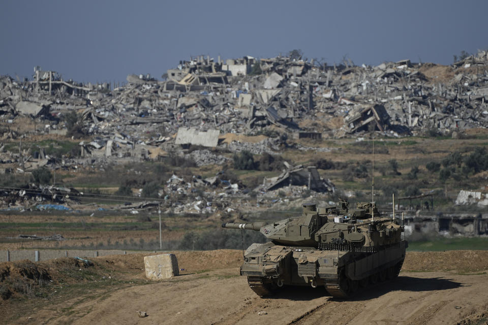 Israeli soldiers take up positions near the Gaza Strip border, in southern Israel, Sunday, Jan.7, 2024. (AP Photo/Ohad Zwigenberg)