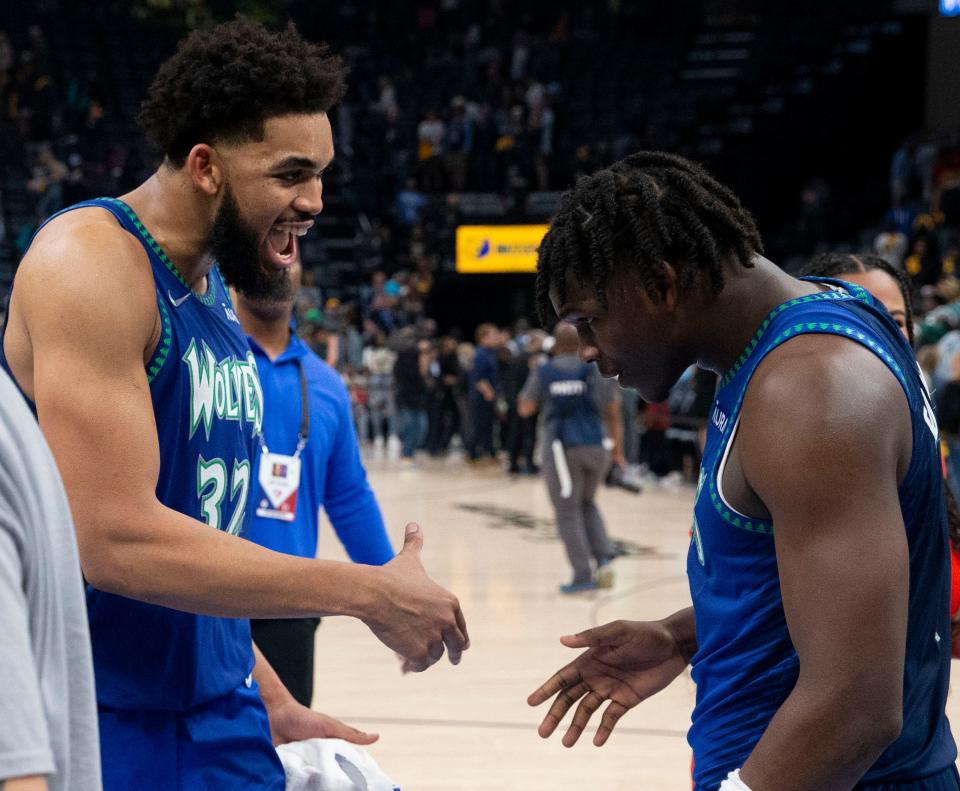 First round: Karl-Anthony Towns (32) and Anthony Edwards (1) celebrate after the Timberwolves stunned the Grizzlies and stole Game 1 in Memphis.