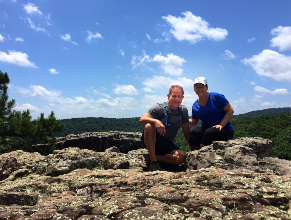 Juan and Mary Montalvo stop for a rest during a hike in the Ozarks in 2016. It was during this hike that the couple decided it was time for a new life adventure.