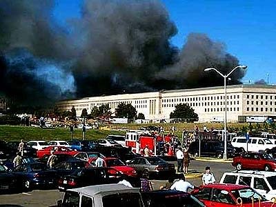 Smoke and flames rise above the Pentagon in Virginia. Shortly after the World Trade Center attack, another aircraft crashed into one wing of the massive military office complex.