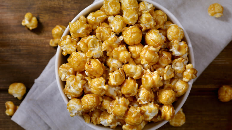 carmel corn spilling out of bowl