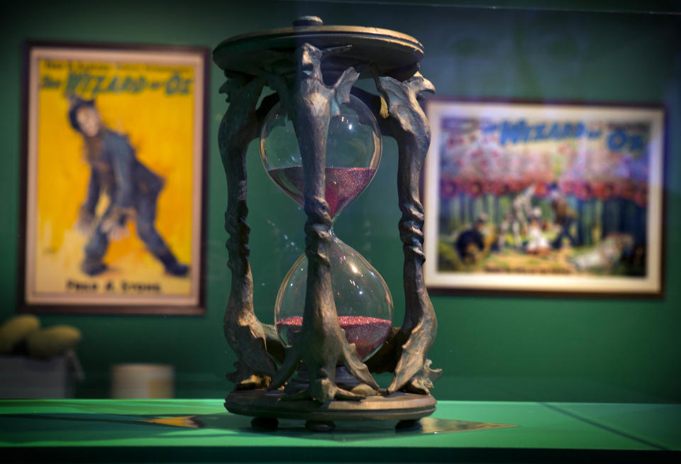 In this Tuesday, Oct. 8, 2013 photo, the hourglass used in the movie, "The Wizard of Oz" is displayed at the Farnsworth Museum, in Rockland, Maine. The world's largest collection of materials from the movie is being exhibited a few months after the release of a prequel to the original film and the release of the original movie in I-Max format. (AP Photo/Robert F. Bukaty)