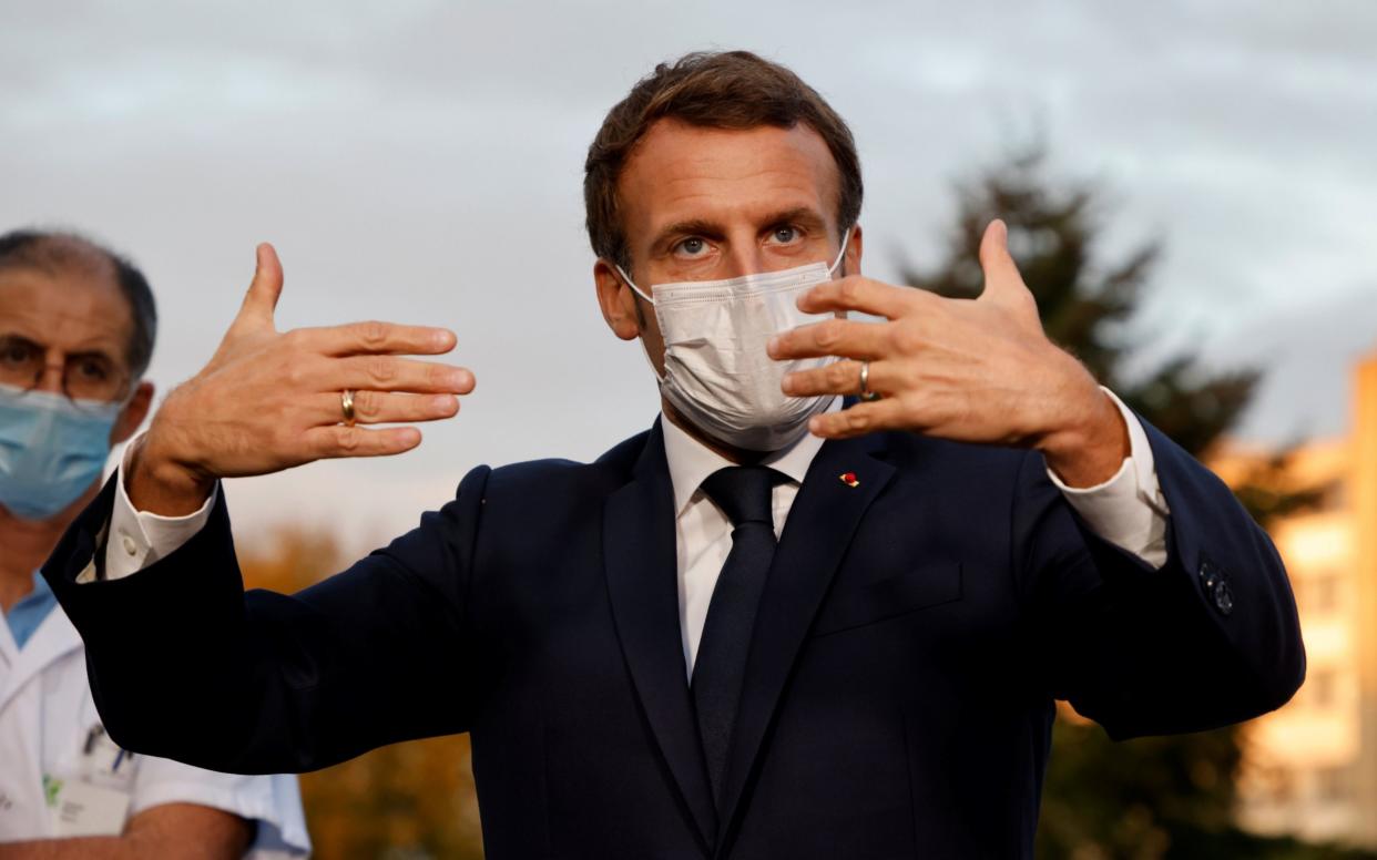 French President Emmanuel Macron at Rene Dubos hospital, Pontoise, France - Ludovic Marin/Shutterstock