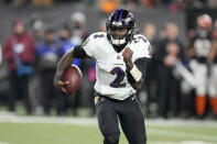 Baltimore Ravens quarterback Tyler Huntley (2) runs with the ball in the first half of an NFL wild-card playoff football game against the Cincinnati Bengals in Cincinnati, Sunday, Jan. 15, 2023. (AP Photo/Darron Cummings)