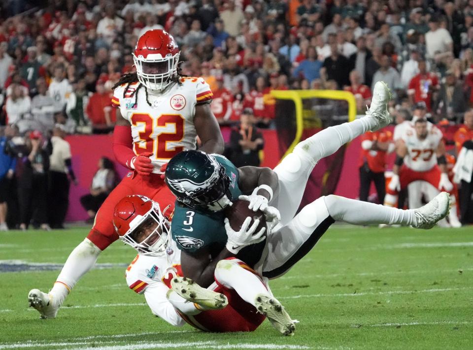 Philadelphia Eagles wide receiver Zach Pascal (3) is tackled by Kansas City Chiefs safety Juan Thornhill (22) during the fourth quarter in Super Bowl LVII at State Farm Stadium in Glendale on Feb. 12, 2023.