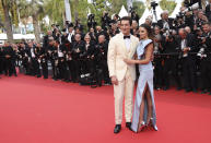 Miles Teller, left, and Keleigh Sperry pose for photographers upon arrival at the premiere of the film 'Top Gun: Maverick' at the 75th international film festival, Cannes, southern France, Wednesday, May 18, 2022. (Photo by Vianney Le Caer/Invision/AP)