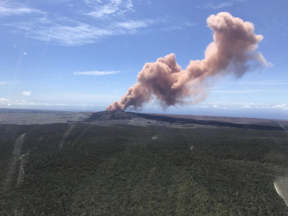 Red ash seen rising from the Puu Oo vent on Hawaii's Kilauea Volcano after a magnitude-5.0 earthquake struck the Big Island on Thursday (Kevan Kamibayashi/U.S. Geological Survey via AP)