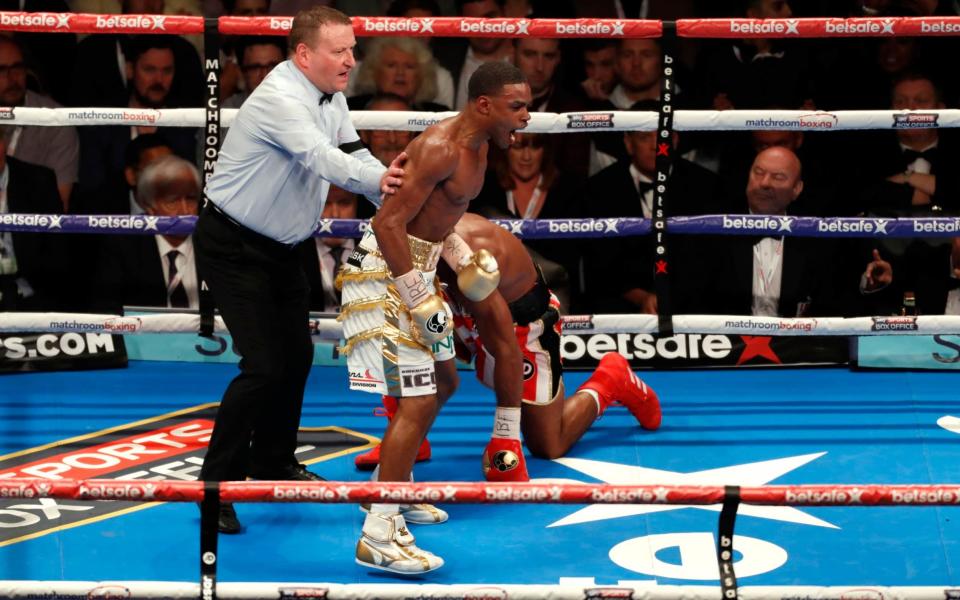 Errol Spence celebrates knocking down Kell Brook in the 11th round - REUTERS