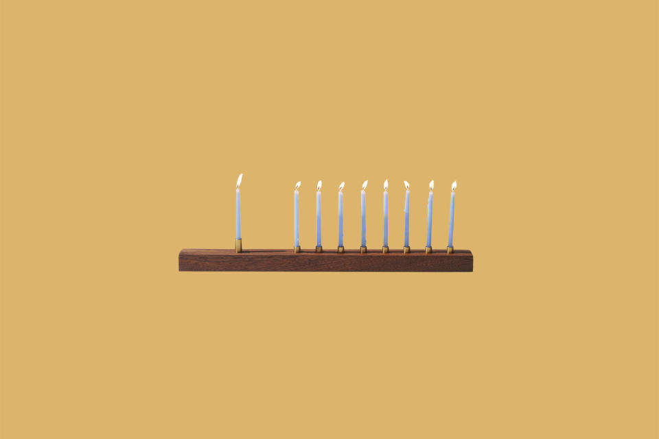 <p>In the market for a simple menorah that's every bit as timeless as it is stylish? Handcrafted in walnut and brass, this minimalist menorah available at Industry West will bring a warm glow to the holiday season. It comes with an optional raised shamash candle holder at 1/2 inch taller too.</p><p><em>Marmol Radziner Menorah, $180, </em><a href="https://www.industrywest.com/marmol-radziner-menorah.html" rel="nofollow noopener" target="_blank" data-ylk="slk:industrywest.com;elm:context_link;itc:0;sec:content-canvas" class="link "><em>industrywest.com</em></a><em>.</em></p>