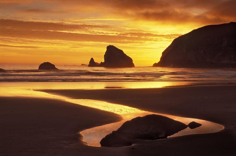 File: Sunset at Harris Beach State Park on the southern Oregon coast.