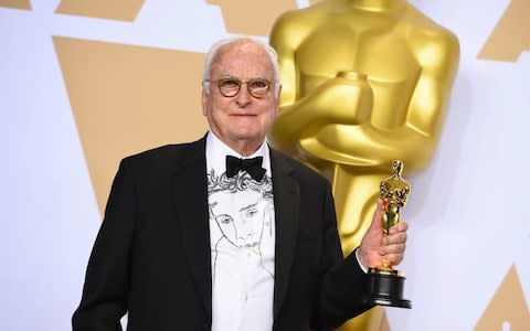 James Ivory with his Academy award - and his Timothee Chalamet shirt - Credit: Invision