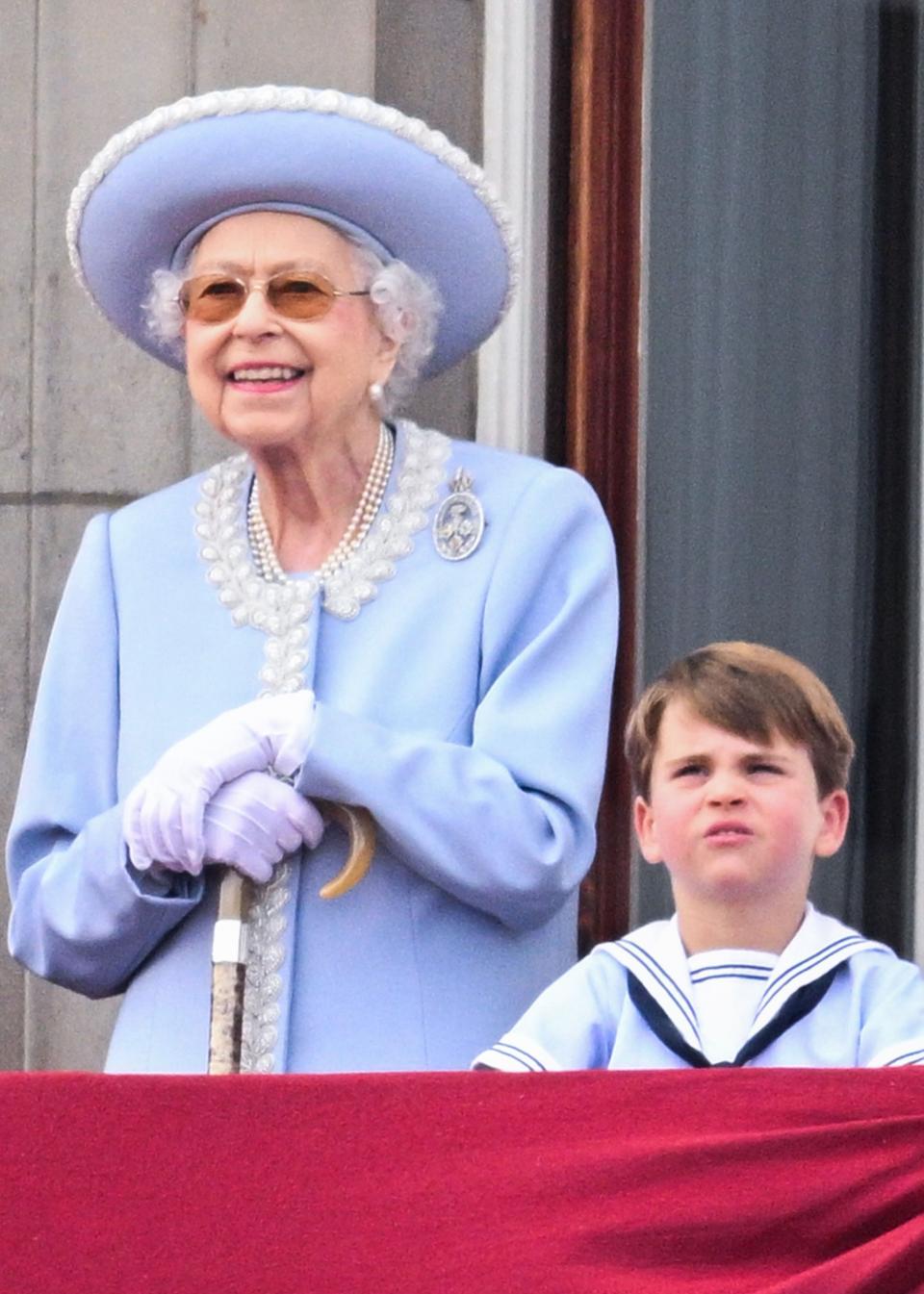 The Queen surveys the scene with Prince Louis during the Jubilee fly past. (PA)