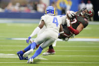 Tampa Bay Buccaneers tight end Rob Gronkowski , right, is tackled by Los Angeles Rams linebacker Terrell Lewis during the second half of an NFL football game Sunday, Sept. 26, 2021, in Inglewood, Calif. (AP Photo/Jae C. Hong)