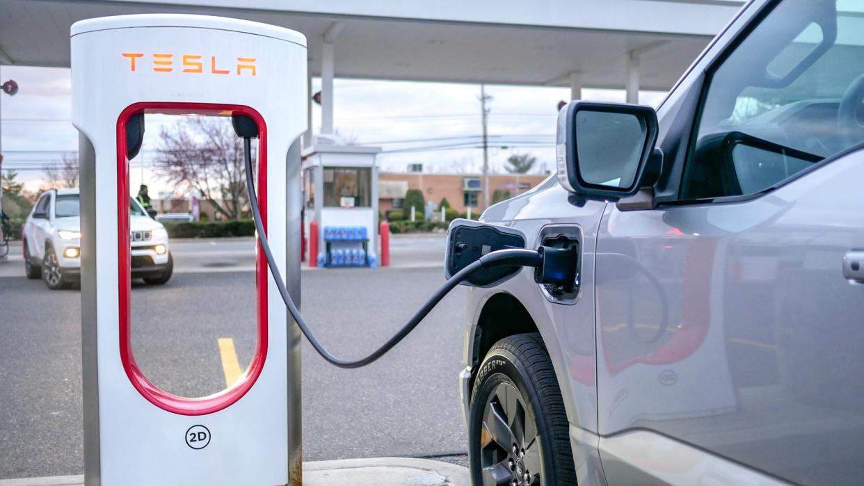  Ford F150 Lightning charging at Tesla station. 