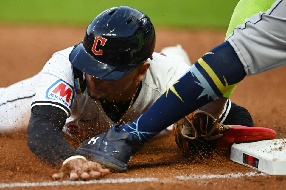 Sep 14, 2024; Cleveland, Ohio, USA; Cleveland Guardians second baseman Andres Gimenez (0) steals third base during the fifth inning against the Tampa Bay Rays at Progressive Field. Mandatory Credit: Ken Blaze-Imagn Images