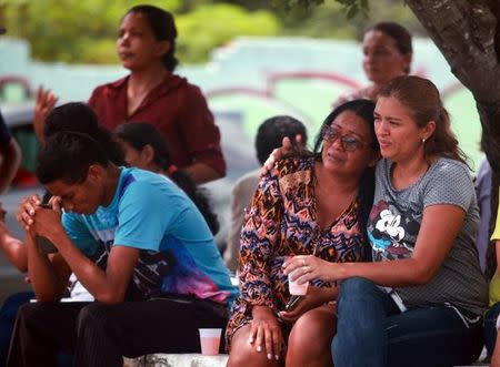 Relatives of prisoners await news in front of the Medical Legal Institute (IML) after the end of a bloody prison riot in the Amazon jungle city of Manaus, Brazil January 2, 2017. REUTERS/Michael Dantas