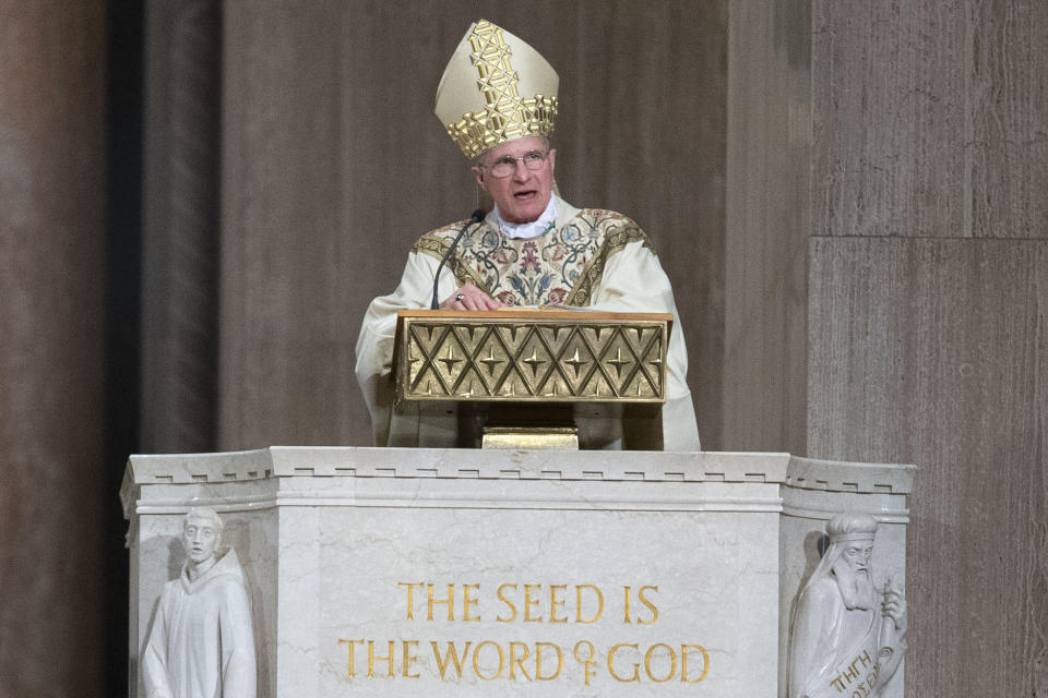 FILE - Archbishop Timothy Broglio conducts an Easter Sunday Mass at Basilica of the National Shrine of the Immaculate Conception in Washington, Sunday, April 12, 2020. Broglio of the Military Services, who oversees Catholic ministries to the U.S. armed forces, was elected Tuesday, Nov. 15, 2022, as the new president of the U.S. Conference of Catholic Bishops. (AP Photo/Jose Luis Magana)