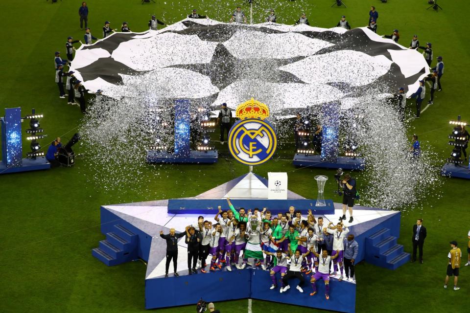 <p>Real Madrid celebrate with the trophy after winning the UEFA Champions League Final </p>