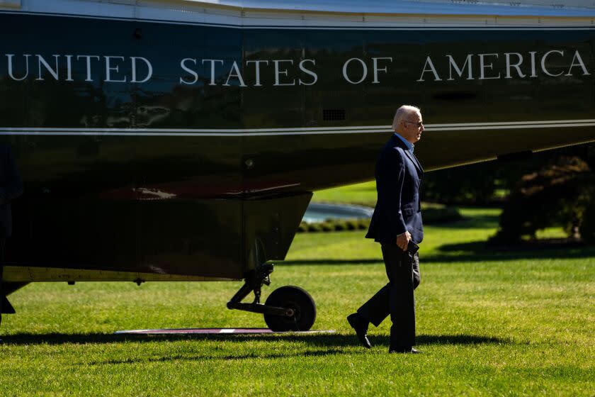 WASHINGTON, DC - OCTOBER 10: President Joe Biden disembarks from Marine One on the South Lawn of the White House and walks to the Oval Office on Monday, Oct. 10, 2022 in Washington, DC. (Kent Nishimura / Los Angeles Times)