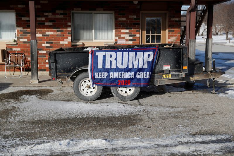 FILE PHOTO: A flag supporting U.S. President Donald Trump sits on trailer in Emmetsburg, Iowa
