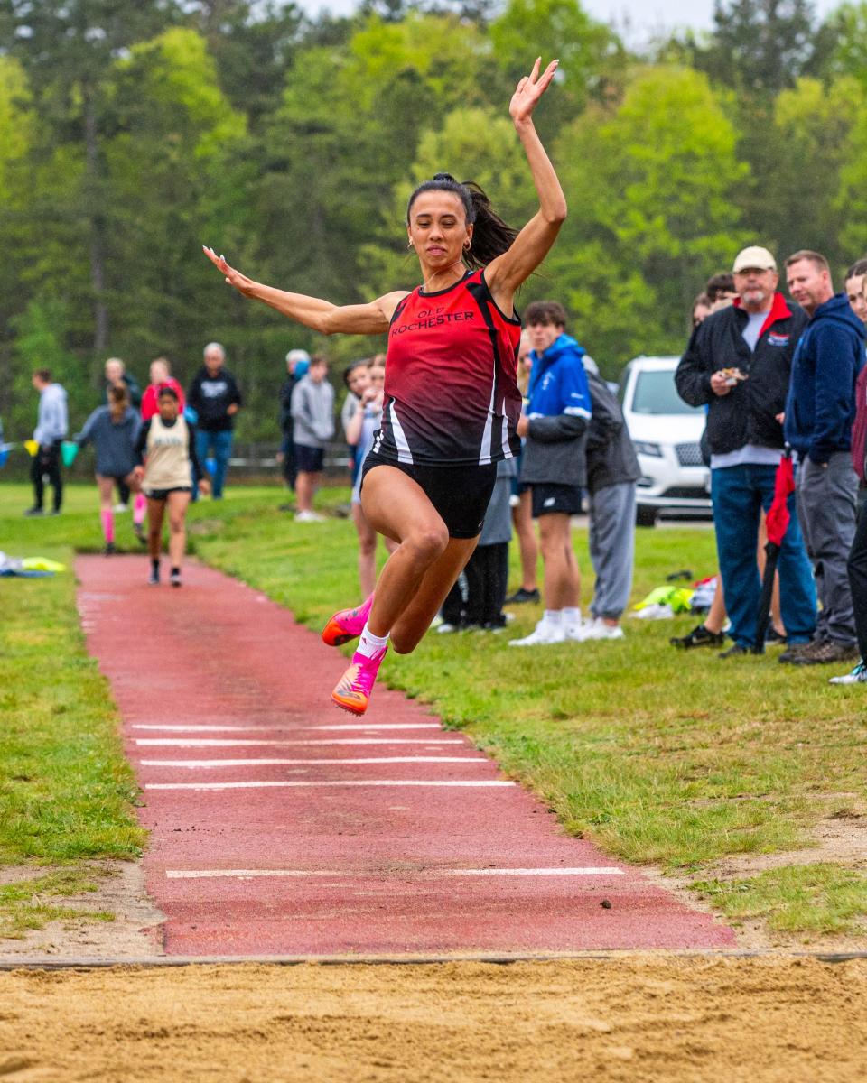 Old Rochester's Maggie Brogioli soars in the air during the long jump.