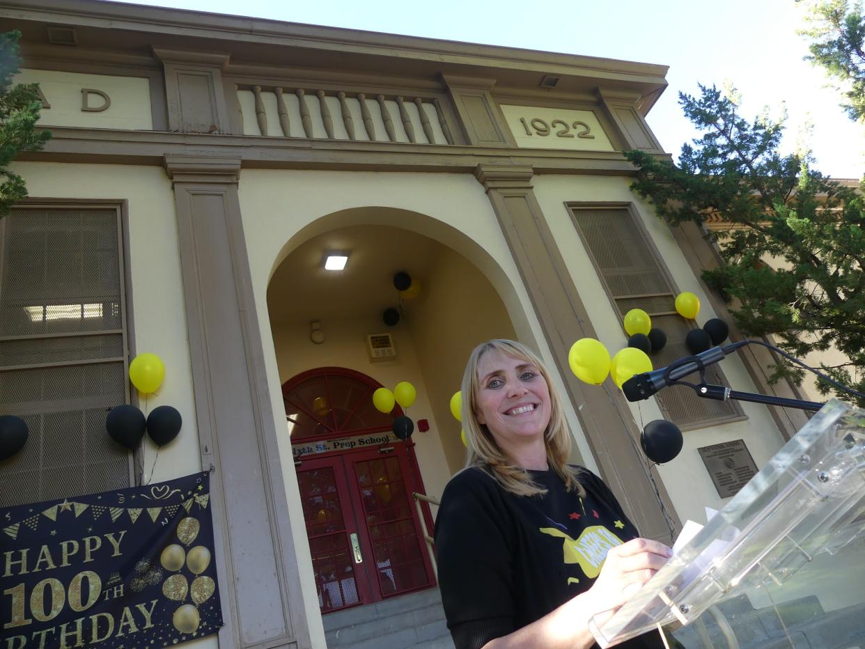 Sixth Street Prep Interim Principal Angela Bishop Cupp prepares to welcome visitors to the 100th anniversary celebration of 
the historic building in downtown Victorville.