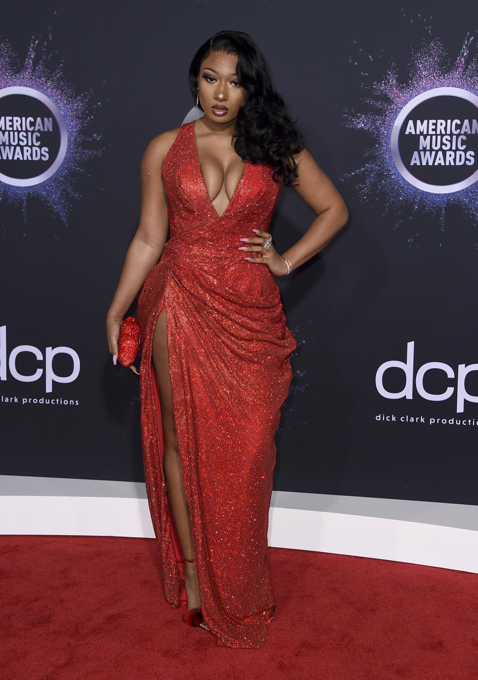 FILE - In this Nov. 24, 2019 file photo, Megan Thee Stallion arrives at the American Music Awards in Los Angeles. The rapper says she was shot multiple times, but expects to fully recover. The 25-year-old said in an Instagram post Wednesday that she had gunshot wounds from a crime committed against her Sunday with the intent to harm her and feels lucky to be alive. She did not say who shot her or why, and Los Angeles police had no immediate comment. (Photo by Jordan Strauss/Invision/AP, File)