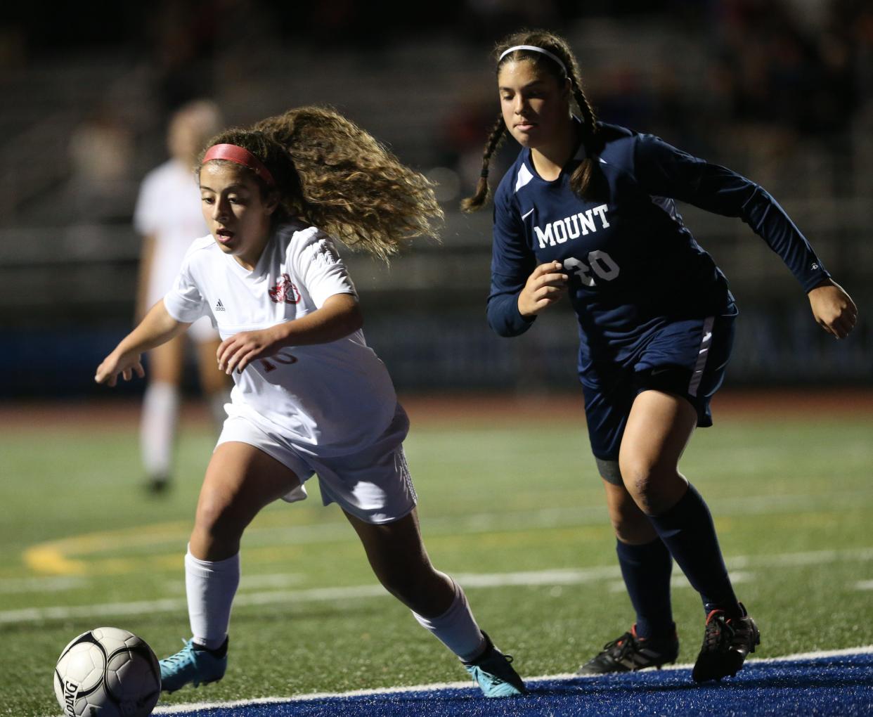 Red Hook's Ani Safaryan moves the ballhe ball to shoot on goal as Mount Academy's Janna Fishli covers her during the MHAL championship in Wallkill on October 24, 2019.  