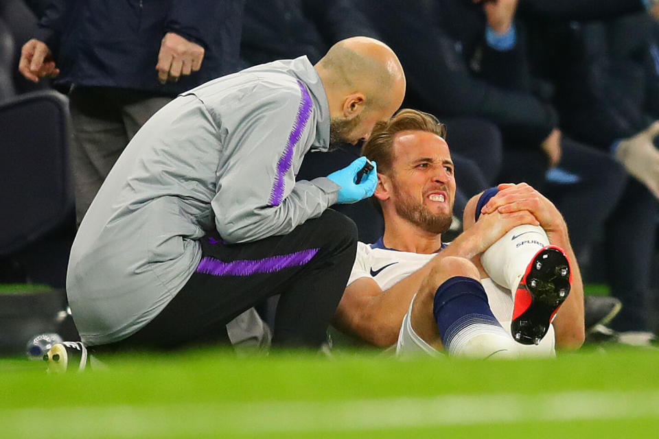 Harry Kane clutches his left leg after suffering an ankle injury against Manchester City (Photo by Chris Brunskill/Fantasista/Getty Images)