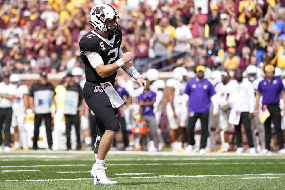 Minnesota quarterback Tanner Morgan celebrates after a touchdown by Minnesota running back Trey Potts during the first half of an NCAA college football game against Western Illinois, Saturday, Sept. 10, 2022, in Minneapolis. (AP Photo/Abbie Parr)