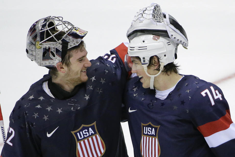 USA goaltender Jonathan Quick greets forward T.J. Oshie after Oshie scored the winning goal against Russia in a shootout during overtime of a men's ice hockey game at the 2014 Winter Olympics, Saturday, Feb. 15, 2014, in Sochi, Russia. (AP Photo/David J. Phillip )