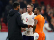 Soccer Football - International Friendly - Netherlands vs England - Johan Cruijff Arena, Amsterdam, Netherlands - March 23, 2018 England’s Jordan Henderson and Joe Gomez with Netherlands' Georginio Wijnaldum after the match Action Images via Reuters/John Sibley