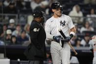 New York Yankees' Aaron Judge, right, talks to home plate umpire Alan Porter after striking out during the sixth inning of a baseball game against the Detroit Tigers, Friday, May 3, 2024, in New York. (AP Photo/Frank Franklin II)