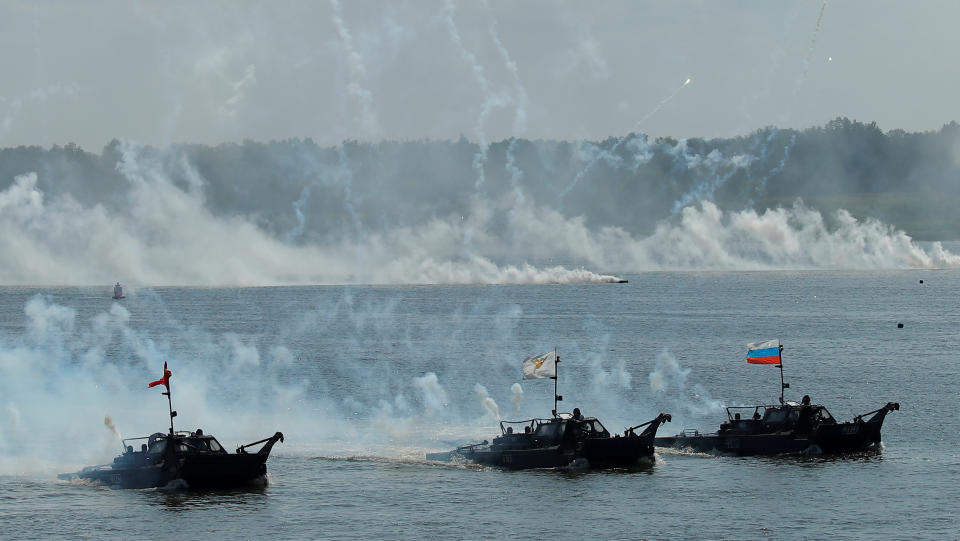 <p>Vessels float along the Oka River during the Open Water competition for pontoon bridge units, as part of the International Army Games 2018, outside Murom, Russia, Aug. 3, 2018. (Photo: Maxim Shemetov/Reuters) </p>