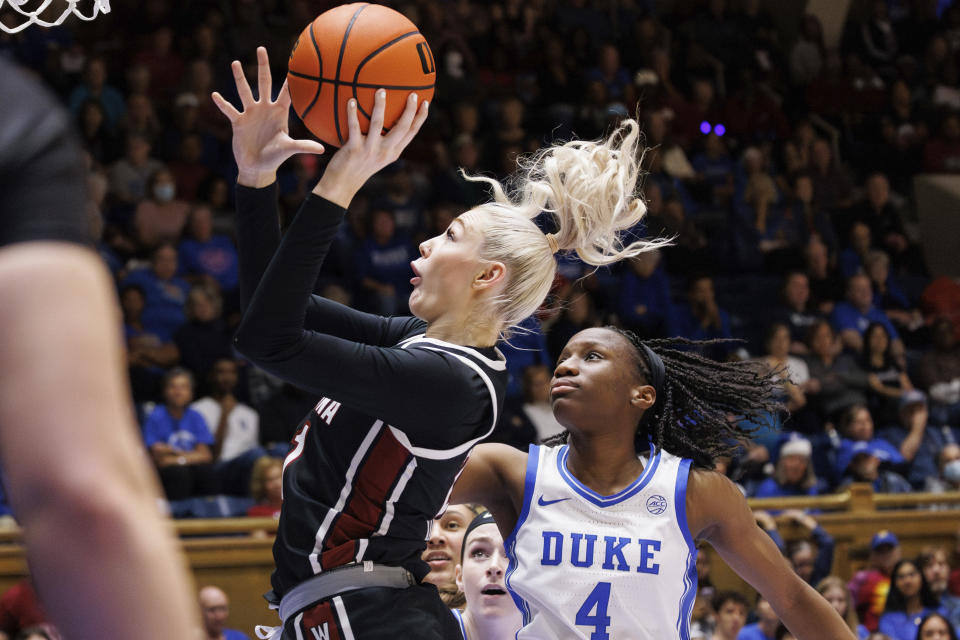 South Carolina's Chloe Kitts, left, attempts a shot ahead of Duke's Jadyn Donovan (4) during the first half of an NCAA college basketball game in Durham, N.C., Sunday, Dec. 3, 2023. (AP Photo/Ben McKeown)