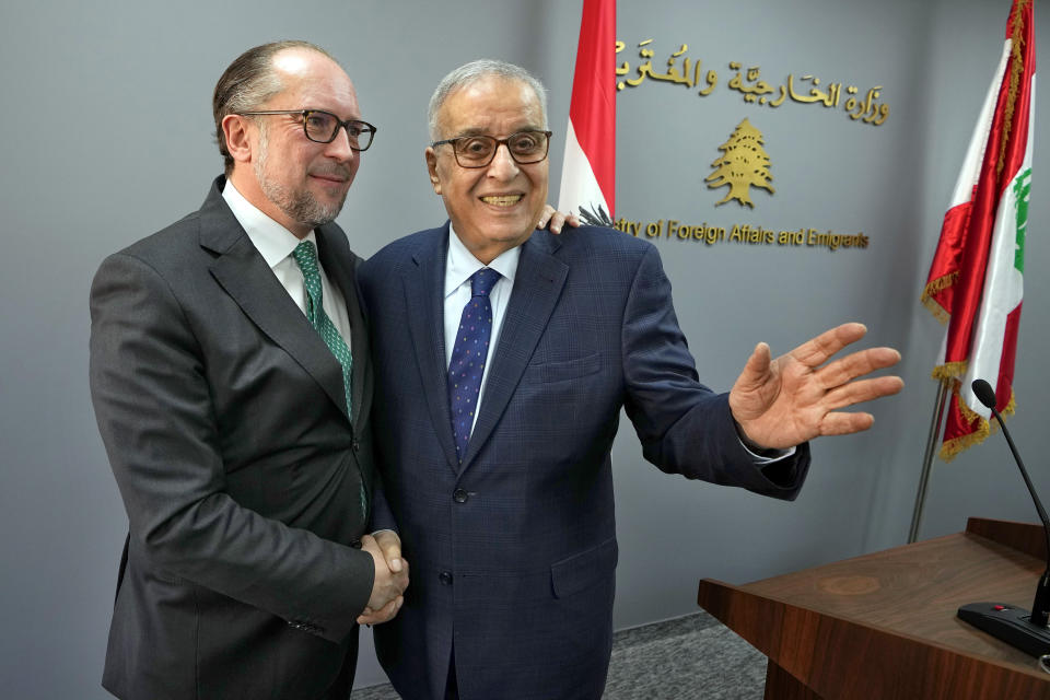 Austrian Foreign Minister Alexander Schallenberg, left, shakes hands with his Lebanese counterpart Abdallah Bouhabib after a joint press conference in Beirut, Lebanon, Thursday, Feb. 29, 2024. Schallenberg urged Israel and Lebanon's militant Hezbollah group not to escalate the conflict along the border saying Thursday that the Middle East has witnessed enough devastation and cruelty. (AP Photo/Bilal Hussein)