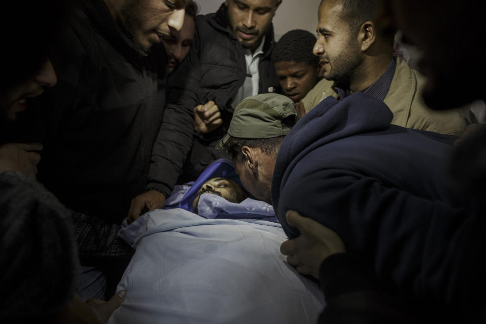 <p>Relatives and friends mourning the death of the Palestinian photographer Ahmad Abu Hussein (24), who died of wounds after being shot by an Israeli sniper while covering the “Great March of Return” protests, April 24, 2018. (Photo: Fabio Bucciarelli for Yahoo News) </p>