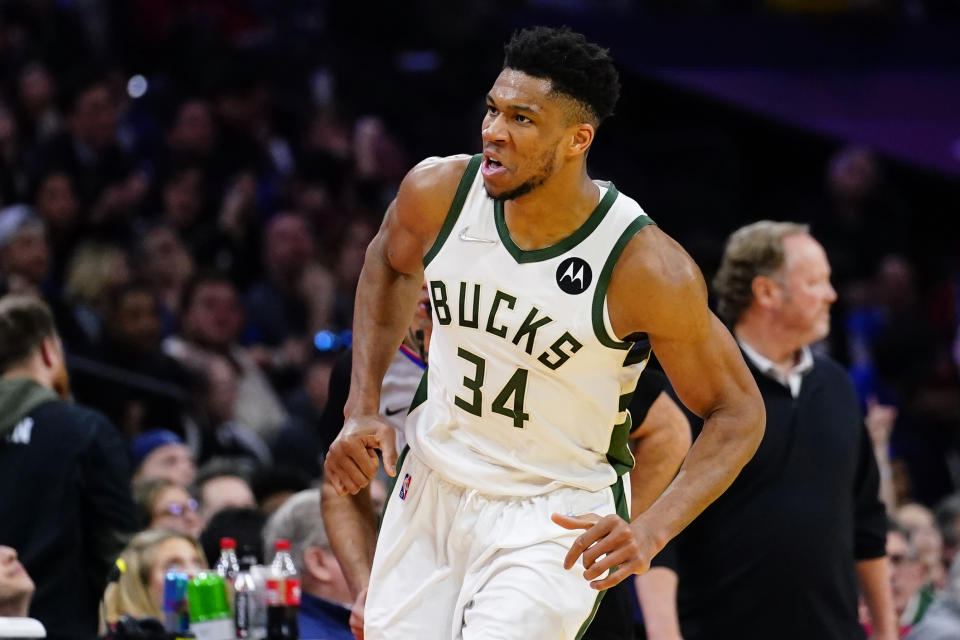 Milwaukee Bucks' Giannis Antetokounmpo reacts after making a basket during the second half of an NBA basketball game against the Philadelphia 76ers, Tuesday, March 29, 2022, in Philadelphia. (AP Photo/Matt Slocum)