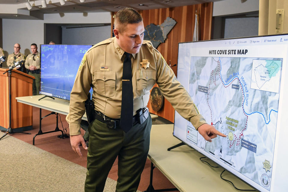 FILE - Mariposa County Sheriff Jeremy Briese points to a map to show where a missing family was found dead during a news conference in Mariposa, Calif., Oct. 21, 2021. A tourist from Michigan who tried to retrace the steps of the family who died during a grueling summer hike in Northern California had to be rescued on June 29, 2022, after getting lost, the sheriff said. The man, who has not been identified, was reported missing near the trail in Mariposa County where officials last year found the bodies of Jonathan Gerrish, his wife, their toddler and their dog. (Craig Kohlruss/The Fresno Bee via AP, File)